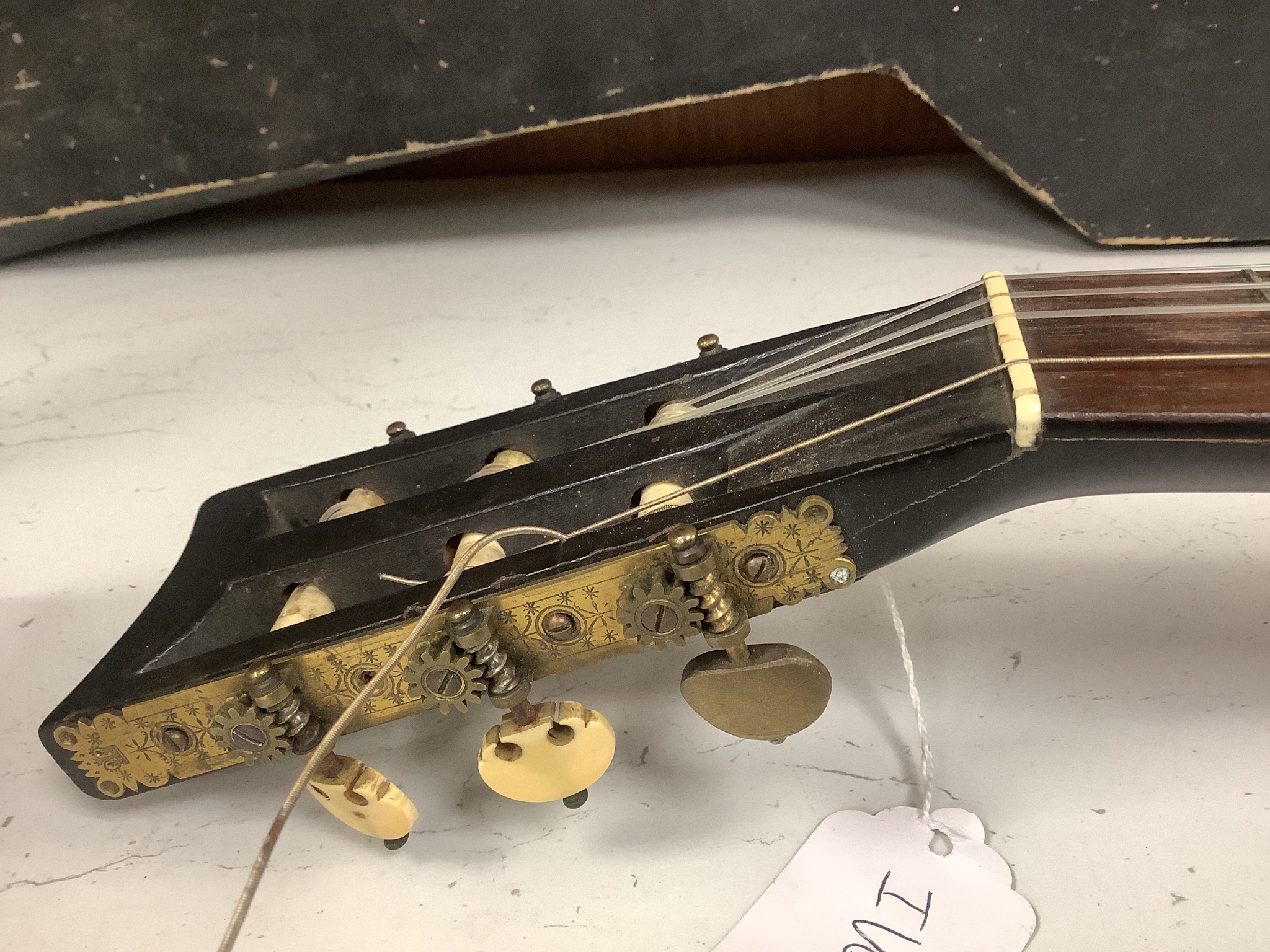A parlour guitar with hard case. Ivory submission reference: J3WBGCHD